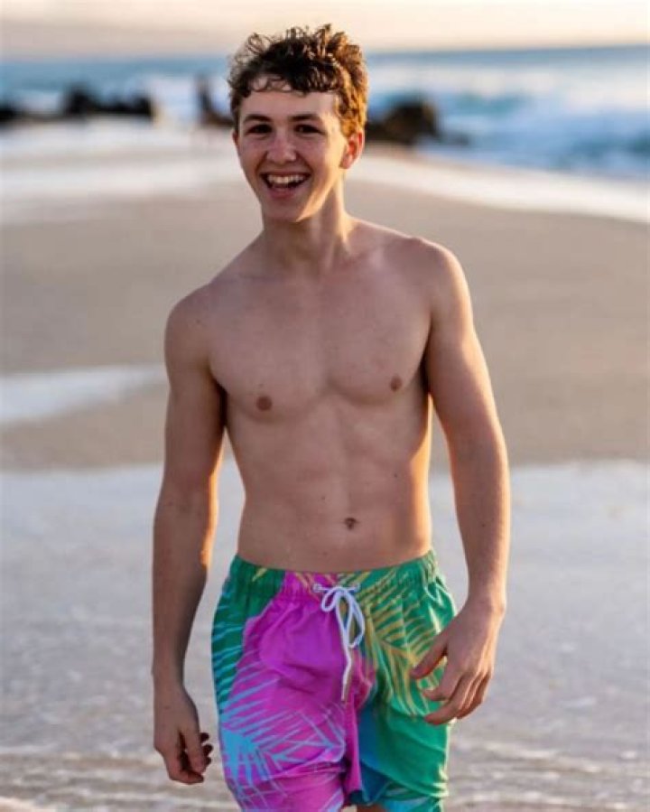 Ethan Wacker posing in the forest of Hawaii in the occasion of world earth day