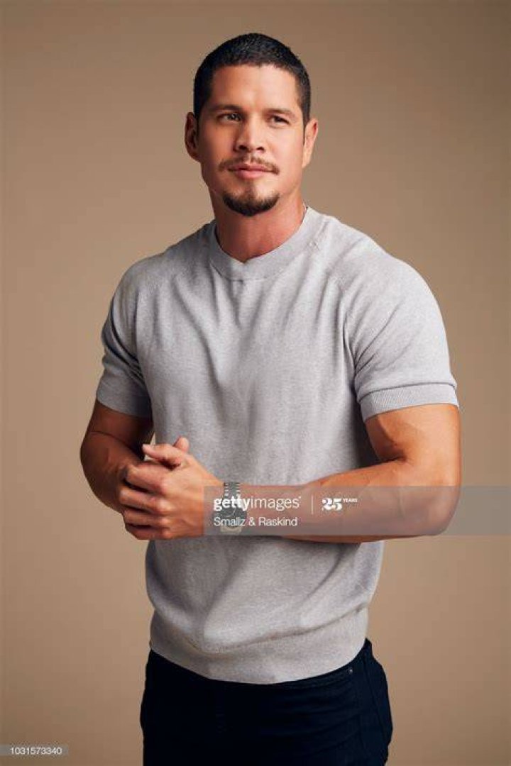 JD Pardo is posing on a black sleeveless leather jacket in the picture.